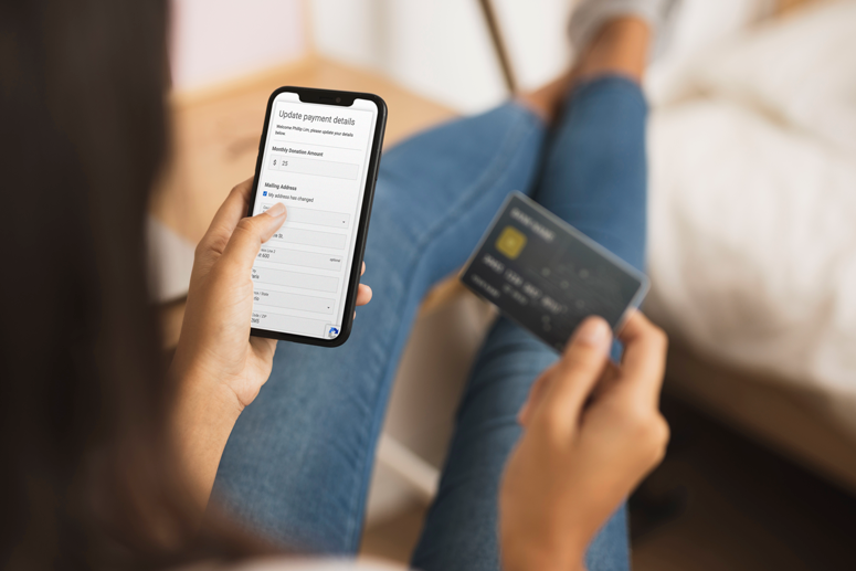 Photo of recurring donor updating their credit card information using raisin Recurring Donor Portal Photo of recurring donor updating their credit card information using raisin Recurring Donor Portal